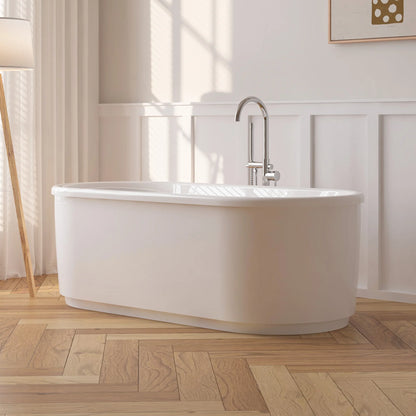 White acrylic freestanding soaking bathtub in a modern bathroom.