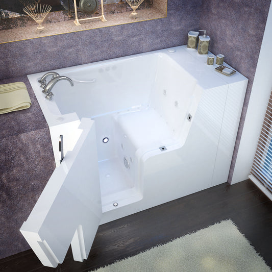 White wheelchair-accessible bathtub with left drain and whirlpool jets in a purple-tiled bathroom; chrome faucet.