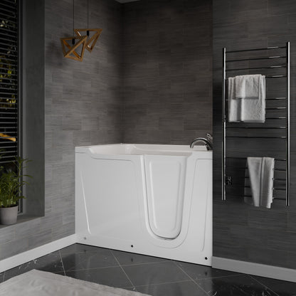 MediTub Meditub collection white alcove bathtub with right-side drain and chrome faucet in a dark tiled bathroom.
